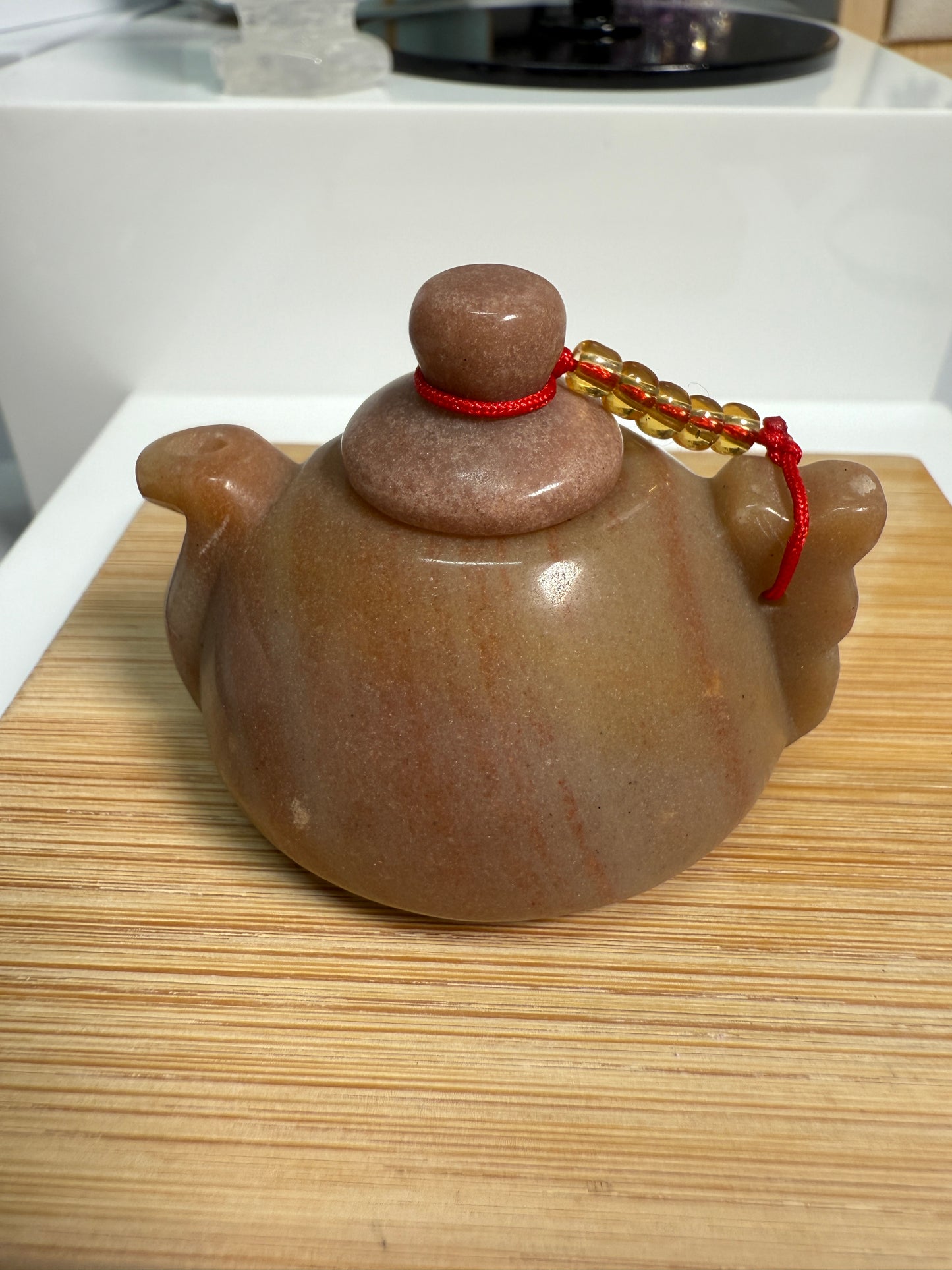 Golden Jasper crystal teapot figurine with warm honey-brown tones and earthy patterns, 2 inches long, shown as elegant decor.