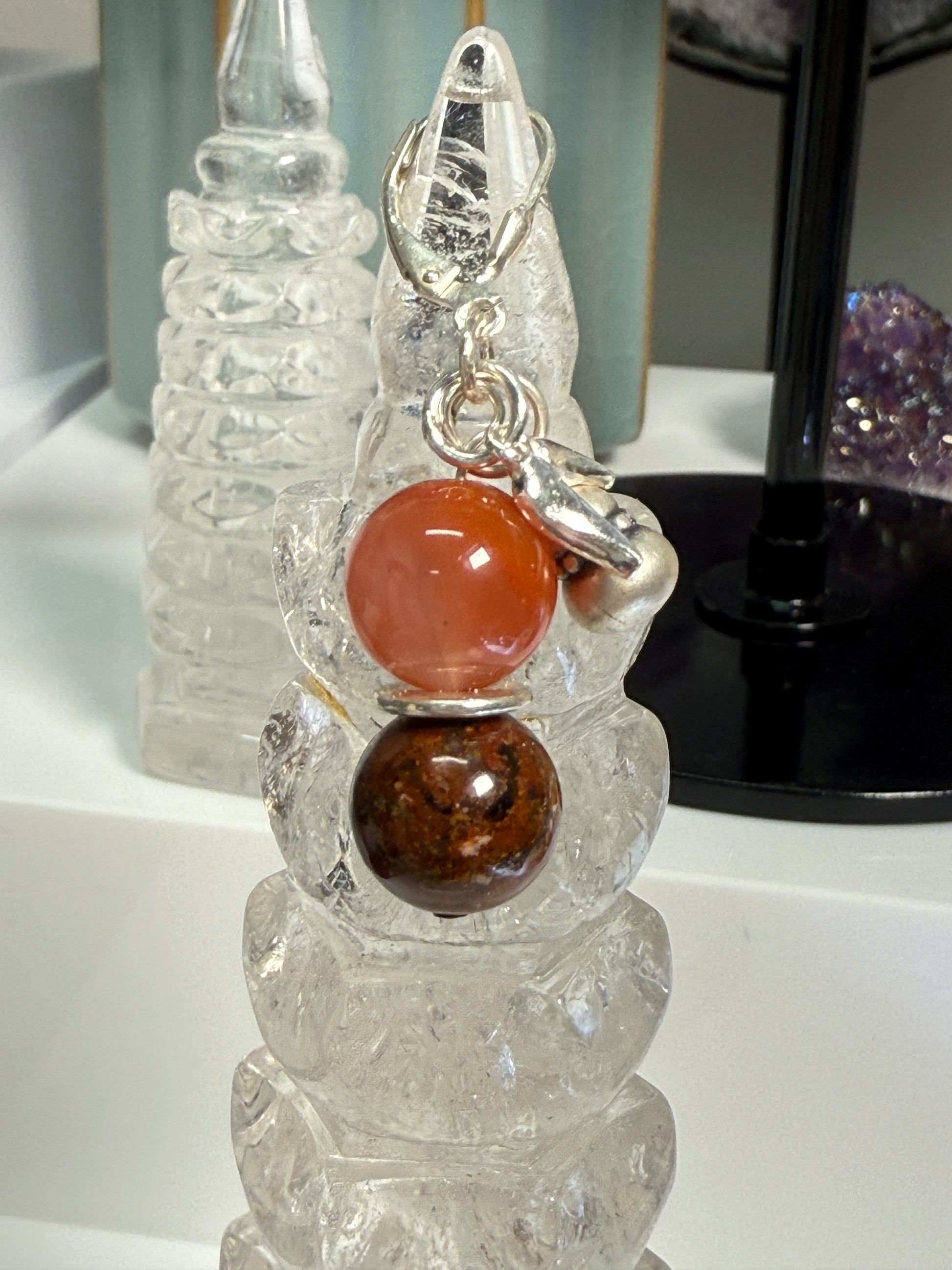Pair of crystal earrings combining South Red Agate and Pietersite, with silver bamboo leaf and gourd details. Photographed as warm, harvest-themed jewelry.